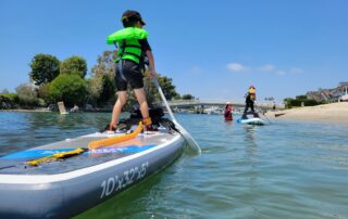 Kids paddle boarding and having fun